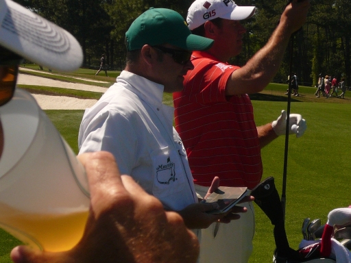 Lee Westwood, his caddie and a guy chugging a brew